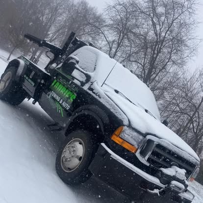 Laurie’s wrecker in snowy weather.